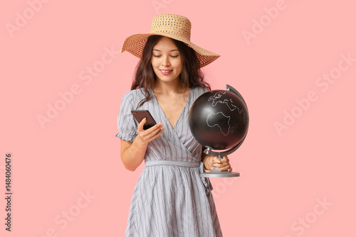 Young Asian woman with glob...