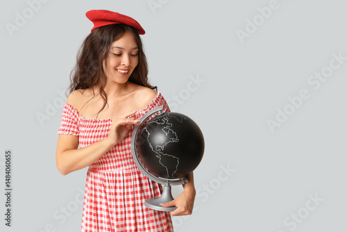 Young Asian woman with glob...