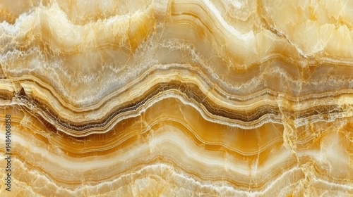 Abstract close up of onyx stone creating a seamless texture of flowing lines in gold and white