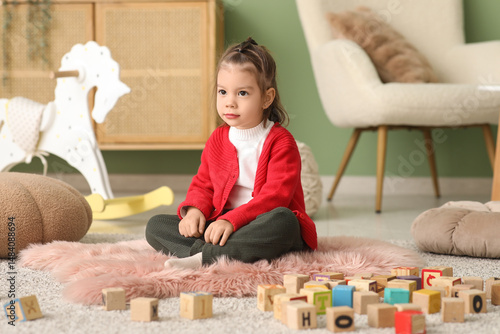 Cute little girl with woode...