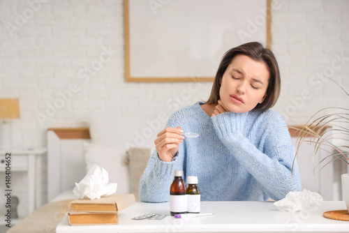 Sick young woman taking cou...