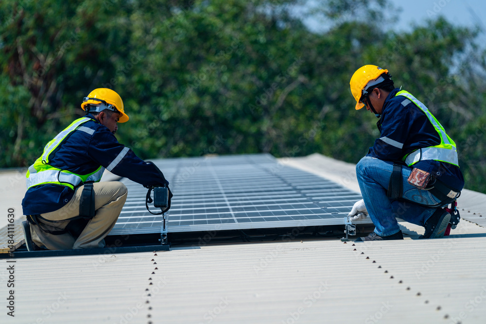 custom made wallpaper toronto digitalTwo engineers install solar panels on a rooftop, wearing safety gear and helmets. The scene showcases renewable energy, green technology, and sustainable solutions under a clear blue sky.