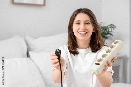 Young woman with plug and e...