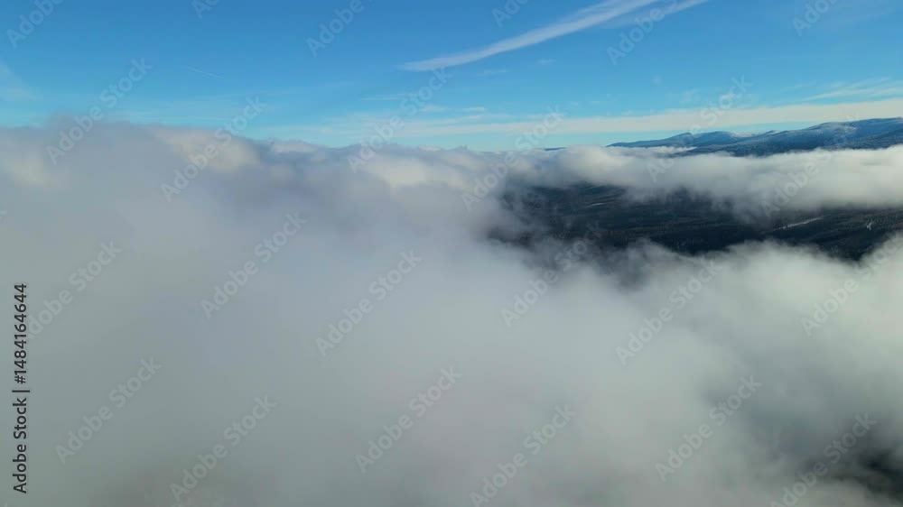 drone landing above the clouds mountains are visible in the distance drone landing above the clouds mountains are visible in the distance