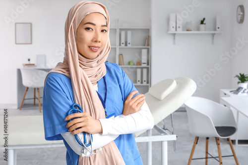 Female Muslim doctor with s...
