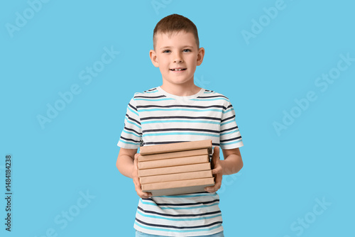 Cute little boy holding sta...