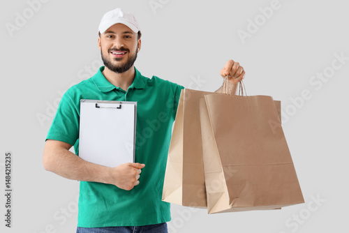Male courier with paper bag...