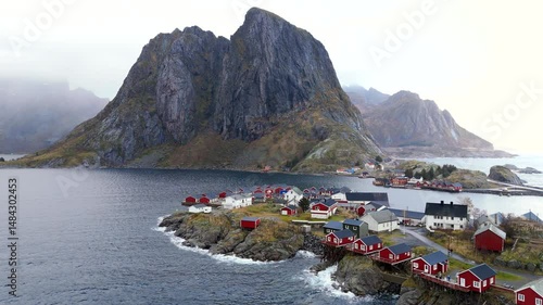 Breathtaking aerial view of majestic mountains enveloped in morning mist at Lofoten Islands, Norway, capturing serene natural beauty and dramatic Nordic landscapes.
