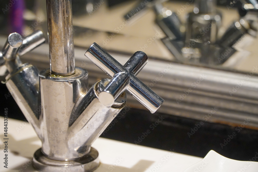 Fototapeta premium Faucet in a modern bathroom, close-up. Selective focus.