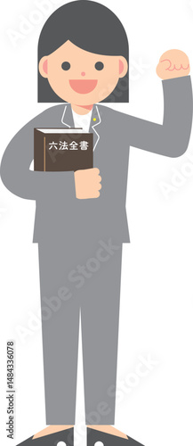 六法全書を手にガッツポーズをするビジネスマン