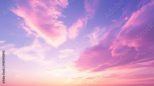 soft, dreamy sky with a gradient of pink and purple hues, featuring wispy white clouds