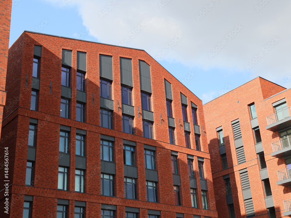 Fototapeta premium Contemporary Modern Red Brick Architectural Design Featuring in an Urban Setting and Landscape