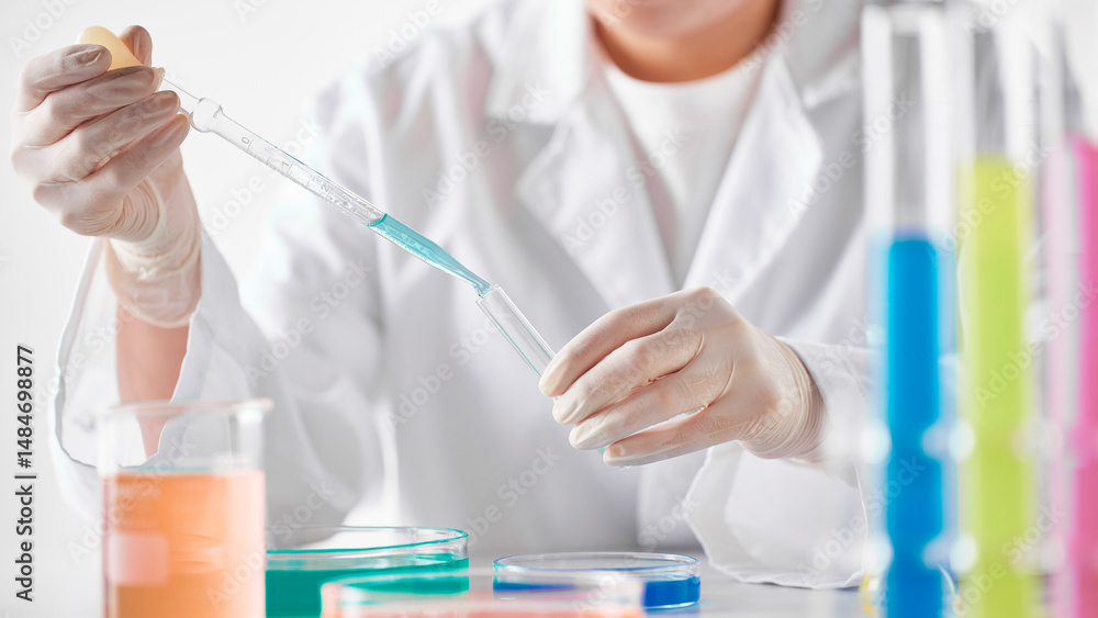 Fototapeta premium Hands Performing Scientific Experiments in a Modern Laboratory Setting.