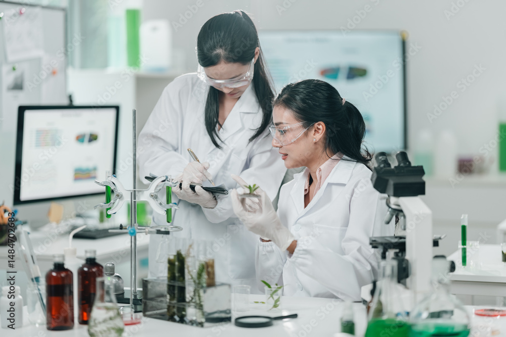 Botanical research in a modern laboratory focusing on algae and plant-based cosmetic development, with scientists analyzing samples under a microscope to explore organic skincare innovations Botanical research in a modern laboratory focusing on algae and plant-based cosmetic development, with scientists analyzing samples under a microscope to explore organic skincare innovations
