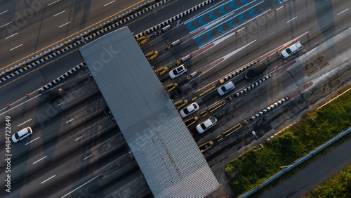 Fototapeta Naklejka Na Ścianę i Meble -  A highway where cars are paying tolls.