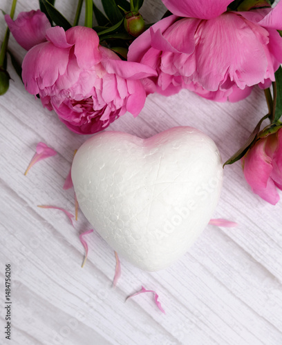 A red peony and a white heart in the background, a valentine