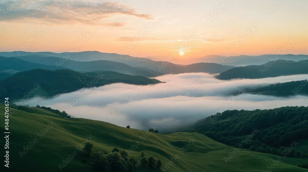Obraz premium Wide Angle Shot of a Dramatic Sunrise Over Rolling Hills with Fog and Scenic Views