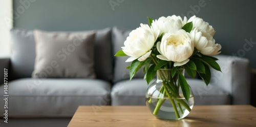 Fototapeta Naklejka Na Ścianę i Meble -  White peonies in vase on coffee table, grey sofa background, peonies, vase, home decor