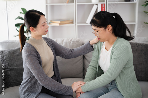 Psychologist, friend or family holding hands to encourage patient with depression, anxiety