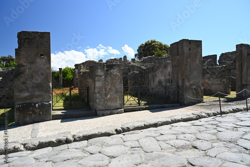 Fototapeta Naklejka Na Ścianę i Meble -  Historic streets of Ancient  roman city of Pompeii Italy on the shadow of Mt Vesuvius.Roman world, UNESCO World Heritage Site, Pompeii Archaeological Park. Italy