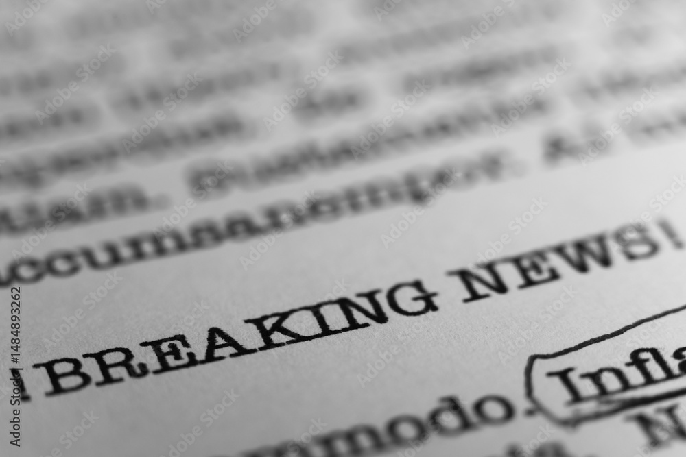 Breaking News headline. Text printed on a page. A piece of paper with a phrase written in retro typewriter font Breaking News headline. Text printed on a page. A piece of paper with a phrase written in retro typewriter font