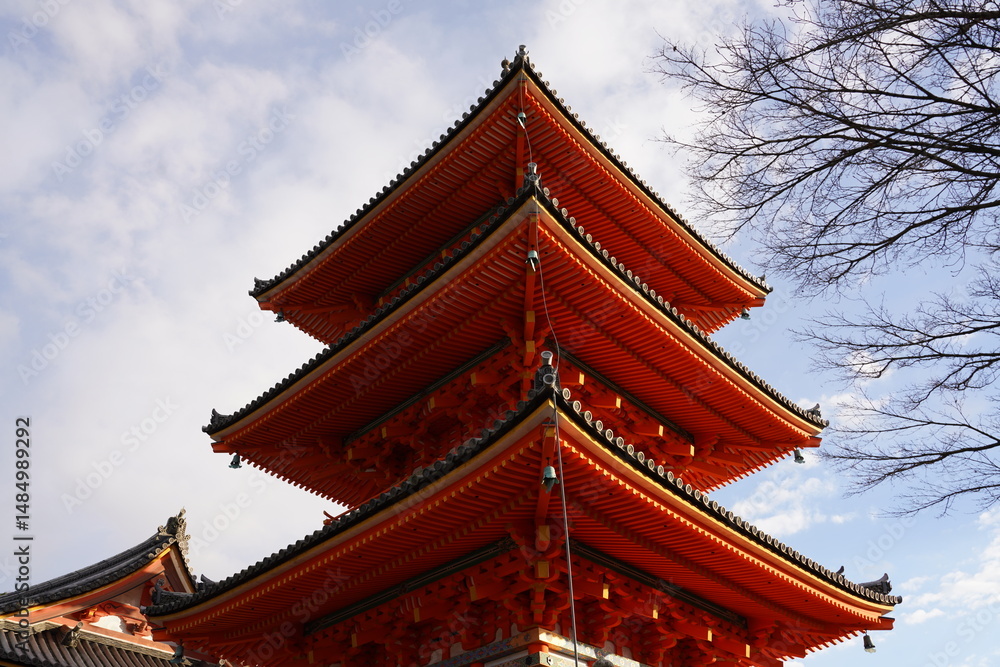 photo of side view of Kiyomizu-dera Temple 3 Story Tower in kyoto Japan. red temple, famous tourist spot for traveling. japanese culture and architecture, pagoda photo of side view of Kiyomizu-dera Temple 3 Story Tower in kyoto Japan. red temple, famous tourist spot for traveling. japanese culture and architecture, pagoda