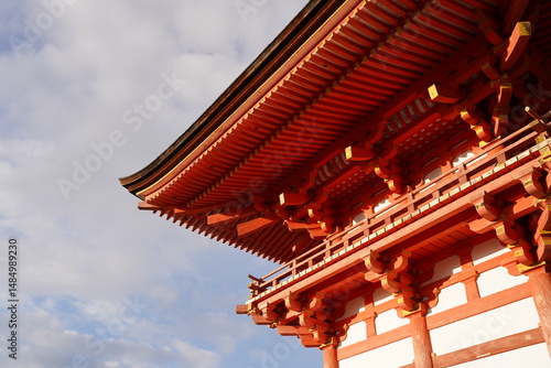a roof angle of a red temple in kyoto japan, beautiful japanese architecture, shining and stunning under the sun 