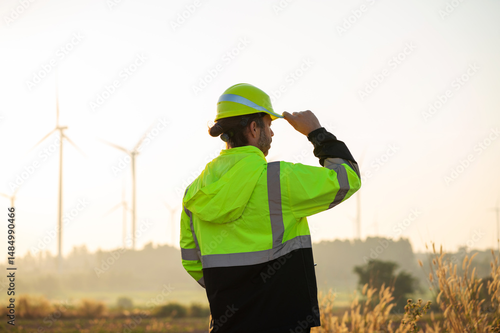 custom made wallpaper toronto digitalEngineer wearing uniform inspection and survey work in wind turbine farms rotation to generate electricity energy. Maintenance engineer working in wind turbine farm at sunset.