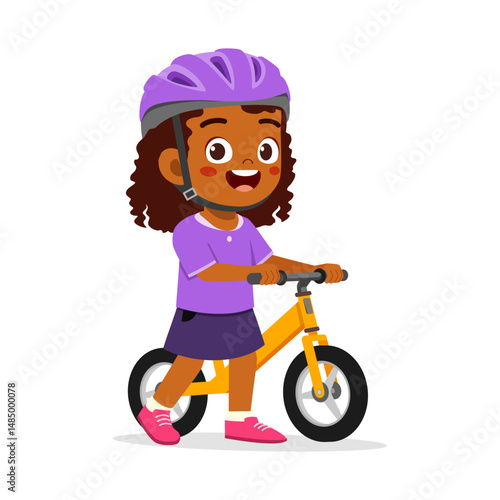 Happy little girl riding balance bike with helmet and smile with isolated background