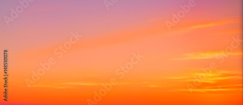 Sky with orange and pink gradient colors at sunset or sunrise.
