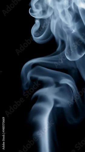 White smoke wisps dancing against black background. Ethereal vapor forms graceful patterns as it rises and dissipates, creating mesmerizing abstract shapes that continuously transform.