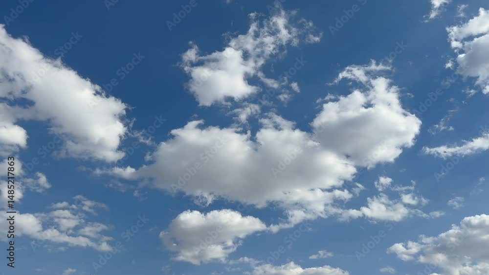 Magical view of cumulus clouds in blue sky. Natural view of white clouds in stunning blue sky. Perfect background for natural concepts. puffy cumulus cloud relaxation weather Summer time. Magical view of cumulus clouds in blue sky. Natural view of white clouds in stunning blue sky. Perfect background for natural concepts. puffy cumulus cloud relaxation weather Summer time.