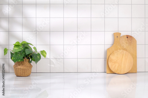 Minimalist Kitchen Decor with Potted Plant and Wooden Chopping Boards