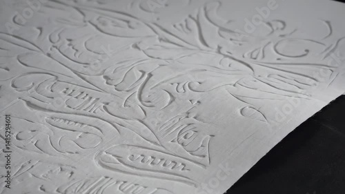 Embossed White Paper Roll with Wave Texture – Soft Light Detail Shot