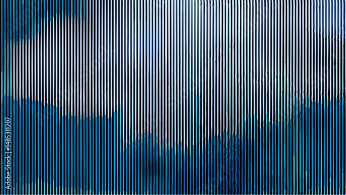 Abstract vertical lines in shades of blue and white creating a textured visual pattern effect