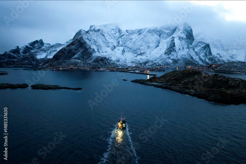 A scenic winter landscape with a boat in front of snowcapped mountains at twilight