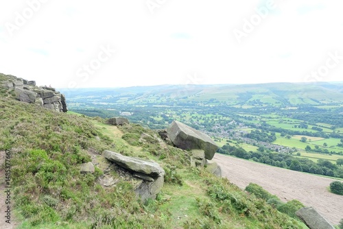 Картината върху платно a man walking up a hill with a dog
