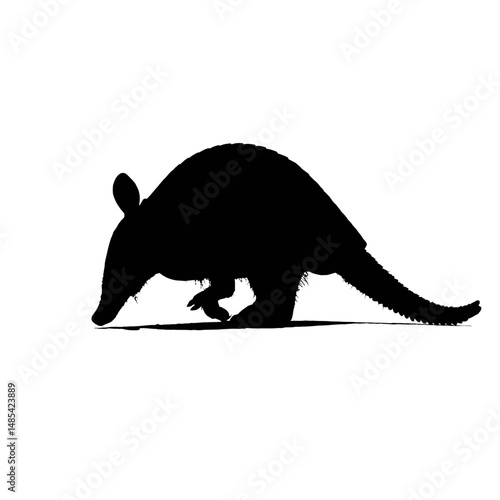 Solid black silhouette of an armadillo rolling