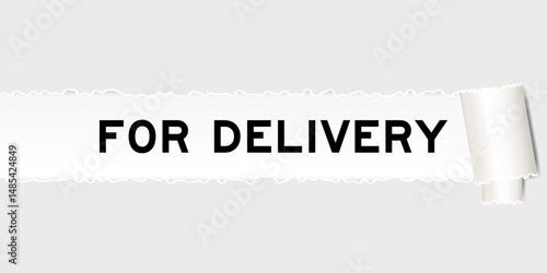 Ripped gray paper background that have word for delivery under torn part
