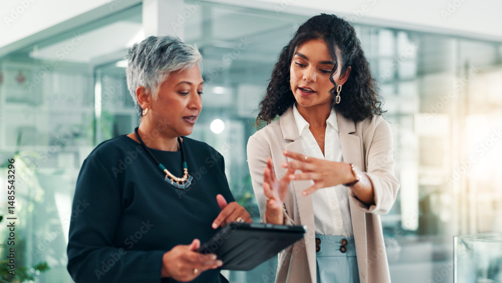 © peopleimages.com - Feedback, tablet and business women in office for project, planning and collaboration. Professional, teamwork and meeting for mentor advice with digital tech for online report, research and website