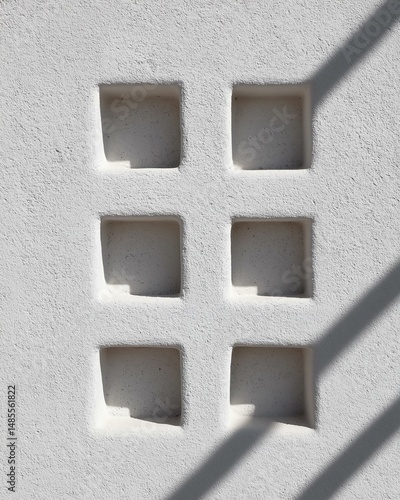 White Stucco Wall with Square Niches. Abstract Architectural Detail