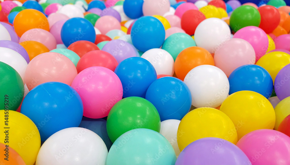 Playful background with plastic toy balls used in childrens indoor parks and entertainment zone Playful background with plastic toy balls used in childrens indoor parks and entertainment zone