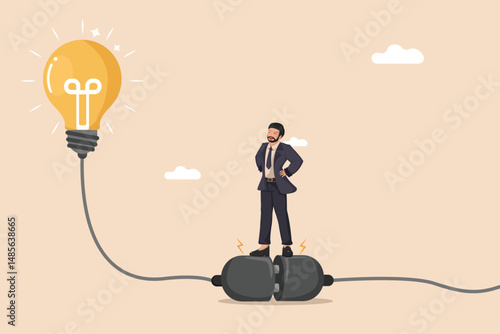 Connecting to Innovation. Businessman Plugging into a Bright Light Bulb Representing a New Idea.