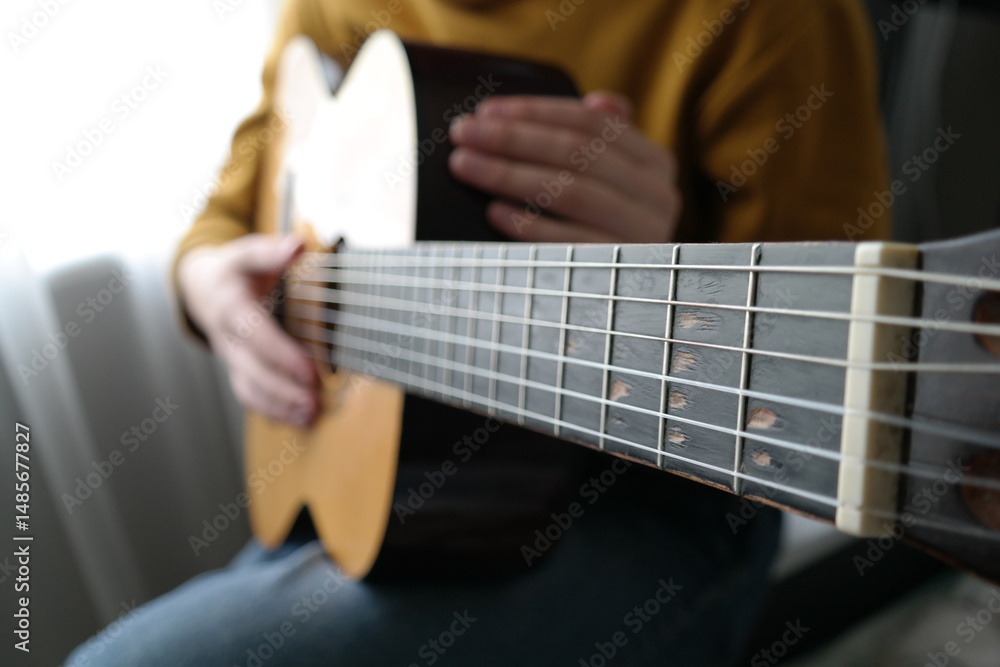 Fototapeta premium guy holding guitar music lesson