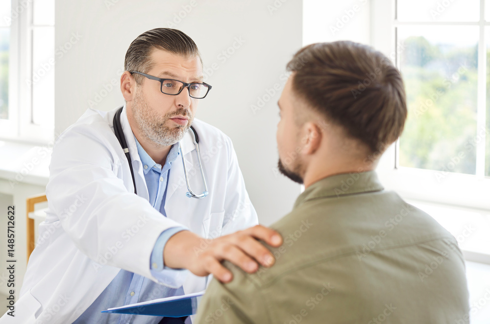 Fototapeta premium Doctor or nurse in communication and talking with a patient, providing medical support and advice in a hospital setting. Healthcare professional ensures the patient receives proper care and guidance.