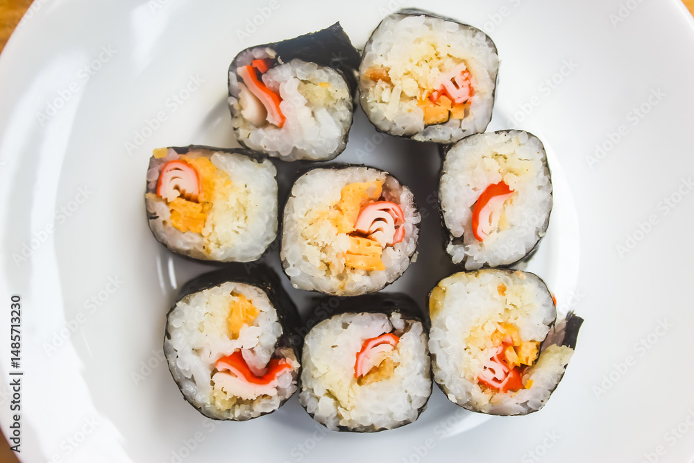 close up of several pieces of sushi on a plate close up of several pieces of sushi on a plate
