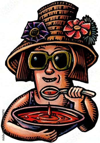 Vászonkép woman in hat and sunglasses enjoying her summer gazpacho soup.