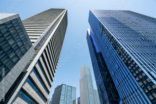 The glass exterior wall of the skyscraper in the financial center