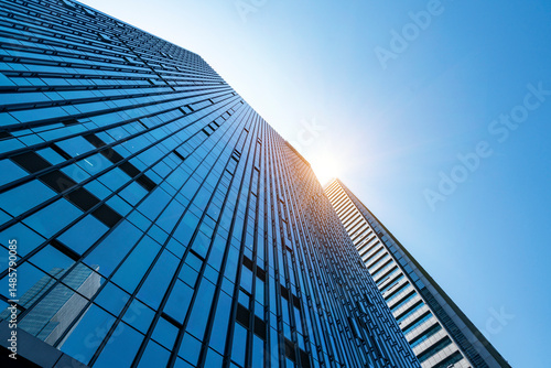 The glass exterior wall of the skyscraper in the financial center