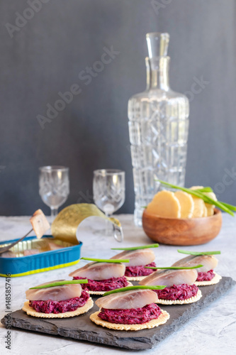 Herring with beetroot on crispy bread.